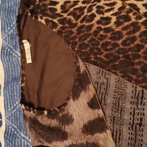Sweater With different animal prints on it.
